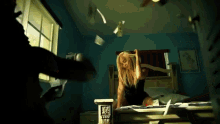 a woman is laying on a bed with papers flying around her