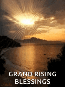 a sunset over a body of water with the words `` grand rising blessings '' written on it .