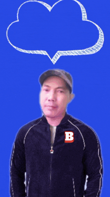 a man in a jacket with the letter b on it