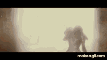 a silhouette of a person standing in front of a window in a room .