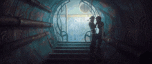a man and woman are standing in a tunnel looking out a window