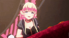 a girl with horns is sitting on a red couch and smiling
