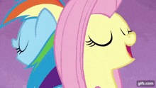 rainbow dash and fluttershy are standing back to back with their eyes closed