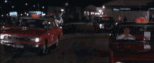 a red car with a taxi sign on top