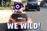 a red toy car with the words we wild on the bottom