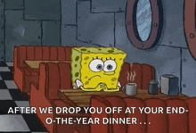 spongebob squarepants is sitting at a table in a diner .