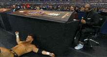a wrestler wearing a bandana that says ' lucha libre ' on it is in a wrestling ring