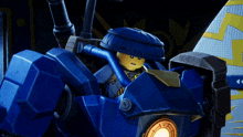 a lego character is sitting in a blue robot with a clock on it