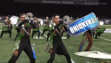 a marching band in indianapolis is holding a can of trendy