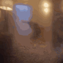 a blurred image of a room with a few lights
