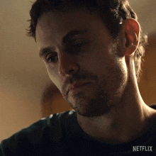 a close up of a man 's face with the word netflix on the bottom