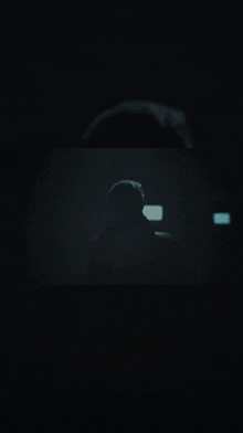 a man in a dark room with the words " это простое задание " in white