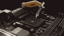 a ryzen processor sits on top of a black motherboard
