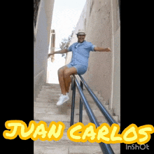 a man is sitting on a railing with the name juan carlos on the bottom right