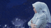 a woman wearing a white hijab and a white dress