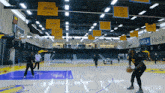 a basketball court with a banner that says ucla health on it