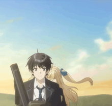 a boy and a girl are standing next to each other and the girl is wearing a blue bow