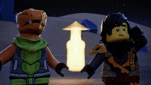 two lego figures standing next to each other in front of a lantern