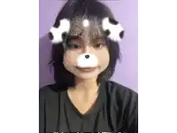 a girl wearing a mask that looks like a dog 's nose