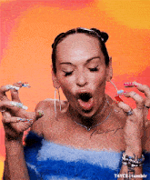 a woman with a tattoo on her chest is holding toothbrushes