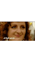 a pixelated image of a woman wearing sunglasses with the letters e6 and o on the bottom left