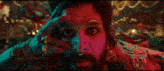 a man with a beard and a nose ring is covering his eyes with his hand