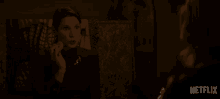 a netflix advertisement shows a woman eating a cookie