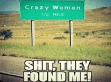 a sign that says crazy woman 1/2 mile on it