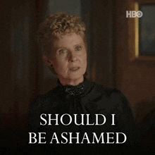 a woman in a black dress says " should i be ashamed "
