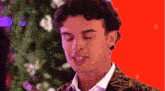 a close up of a man 's face against a red background