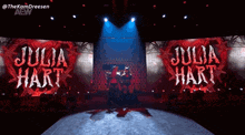 a wrestler named julia hart is on stage