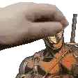 a hand is holding a sword over a statue of a man .