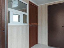 a hallway with a door and a window that says " вытовки "