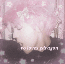 a picture of a girl with pink hair and the words ro loves gdragon below her