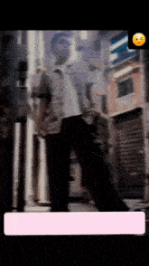 a blurry photo of a man standing in front of a building