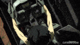 a gif of a man sitting in a cockpit with the website gifrun.com visible