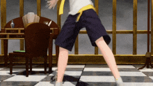 a person in shorts is dancing in a room