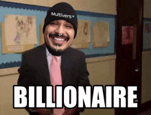 a man wearing a beanie that says multivers stands in a hallway and says billionaire