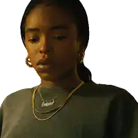 a woman wearing a necklace with a name tag that says catched