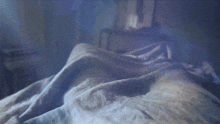 a cartoon character is laying on a bed