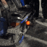 a motorcycle with a license plate that says 710-45670