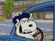 snoopy is driving a blue car and wearing a blue hat .