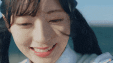 a close up of a woman 's face with pigtails