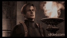 a man in a video game is standing next to a torch and the website clideo.com is displayed in the corner