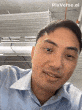 a man in a blue shirt is smiling with pixverse.ai written on the bottom