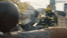 a blurred image of a city with the hashtag #karatexmovie