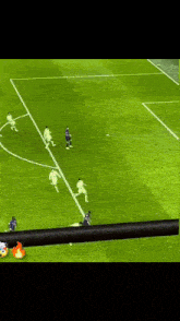 a soccer game is being played on a field with players running on it