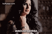 a woman with long hair is wearing a watch and a bracelet .