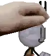 a hand is touching a stick figure 's head with a towel .