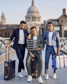 three men are standing on a bridge holding suitcases and one of them says noapte buna